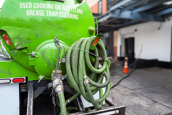 a service truck pumping grease from a restaurant's grease trap in Glen Carbon, IL